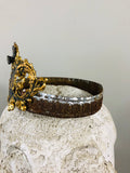 Crown with cherub medallion and small crown