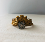Metal crown with cherubs and rhinestone flower