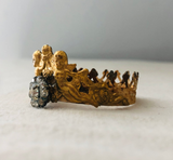 Metal crown with cherubs and rhinestone flower
