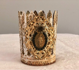 Feather leaf crown with Mary on front encircled with black rhinestones