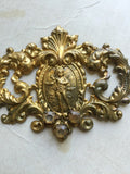 Metal Finding with cherub in center and 3 rhinestones