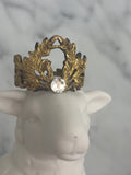 Gold crown with rhinestone center