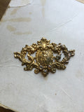 Metal Finding with cherub in center and 3 rhinestones