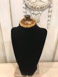 Black velvet bust with barn wood base