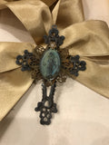 Metal cross with patina green Mary and small gold flower