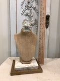 Burlap bust jewelry holder with vintage crystal knob and vintage barn wood base.