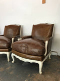 Pair French Bergere arm chairs in leather with down feather cushions and ladder back seats,reversed scrolled feet