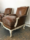 Pair French Bergere arm chairs in leather with down feather cushions and ladder back seats,reversed scrolled feet