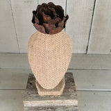 Burlap bust on barn wood stand with rose on top