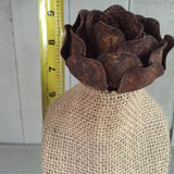 Burlap bust on barn wood stand with rose on top