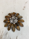 Daisy metal layered flower with a rhinestone cluster of flowers in the center