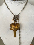Puff Heart and cross attached to filigree piece