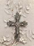 Metal cross layered with rhinestone cross