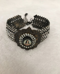 Rhinestone bracelet, embellished rhinestone bracelet and a round mary pendant