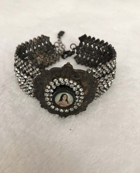Rhinestone bracelet, embellished rhinestone bracelet and a round mary pendant