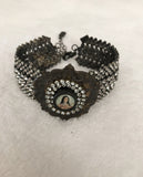 Rhinestone bracelet, embellished rhinestone bracelet and a round mary pendant