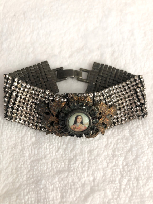 Rhinestone bracelet, embellished rhinestone bracelet and a round mary pendant