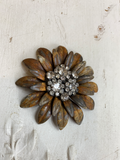 Daisy metal layered flower with a rhinestone cluster of flowers in the center