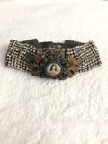 Rhinestone bracelet, embellished rhinestone bracelet and a round mary pendant