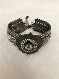 Rhinestone bracelet, embellished rhinestone bracelet and a round mary pendant