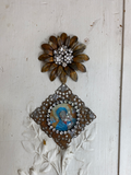 Daisy metal layered flower with a rhinestone cluster of flowers in the center