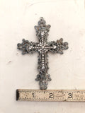 Metal cross layered with rhinestone cross