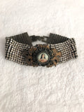 Rhinestone bracelet, embellished rhinestone bracelet and a round mary pendant