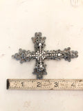 Metal cross layered with rhinestone cross